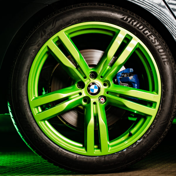 Green colored wheels on a car